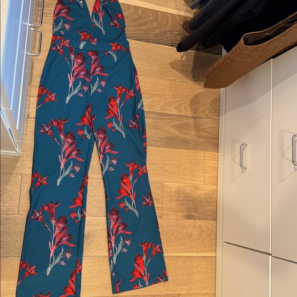 Floral Jumpsuit. So adorable, worn once, side zipper. Halter style, open back - Picture 1 of 3